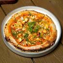 Wood-fired pizza being prepared at High Brew Bangalore